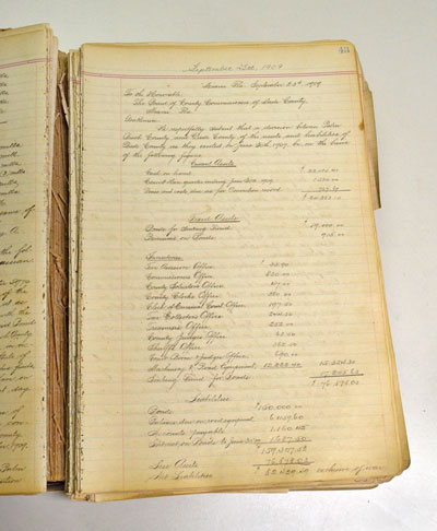 The figures used to determine how much Palm Beach County owed Dade County as established in the separation agreement are depicted here in the minutes of the Sept. 25, 1909 meeting.