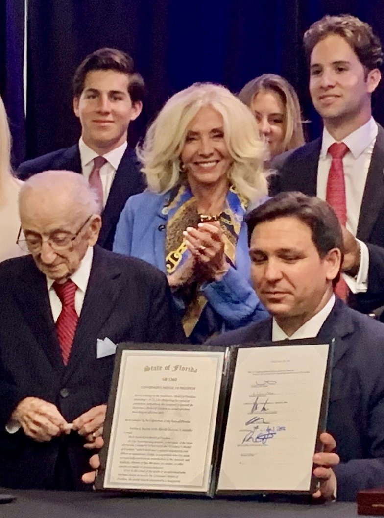 Commissioner Sachs at medal presentation with Ben Ferencz and Governor DeSantis