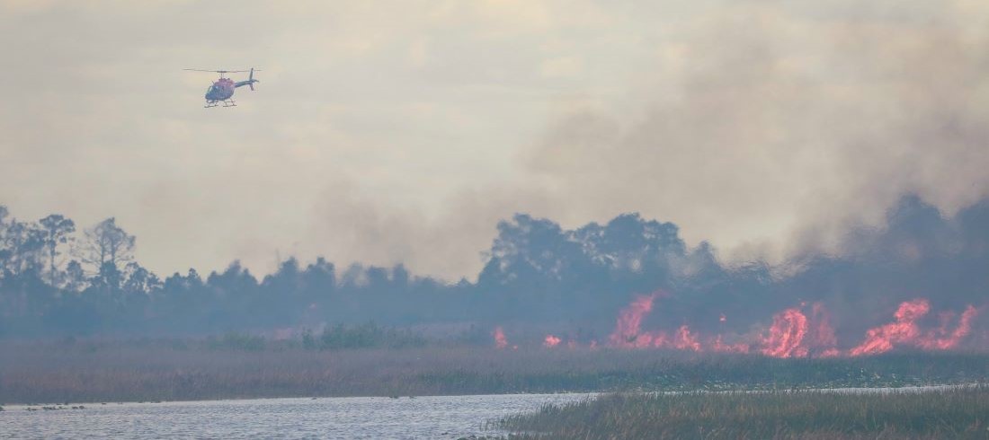 Helicopter flying near burn area