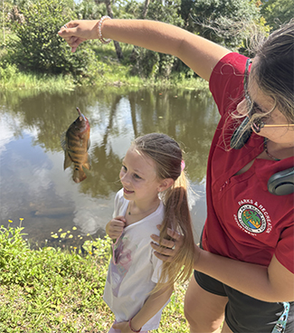 woman and child with fish