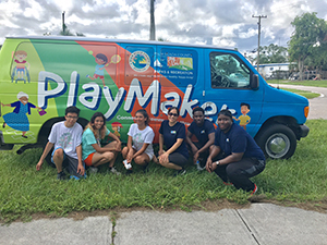 Group of teens outside PlayMakers van