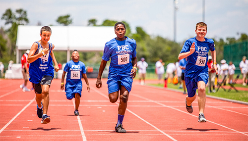 special olympics participants running on a track